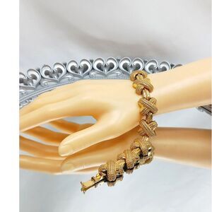 Lovely vintage 90s IVANA Trump golden "X" bracelet